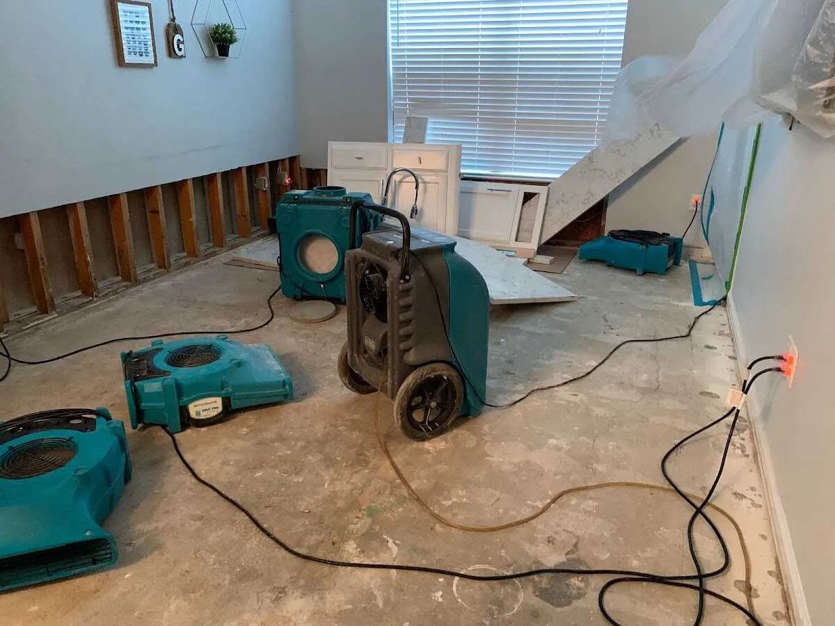 Dehumidifier in flood-cut room for Water Damage Restoration in Landen